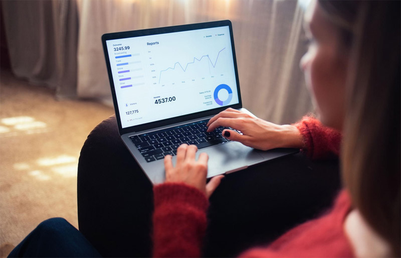 Content creator reviewing YouTube analytics dashboard on laptop — building a structured feedback system to make better content decisions